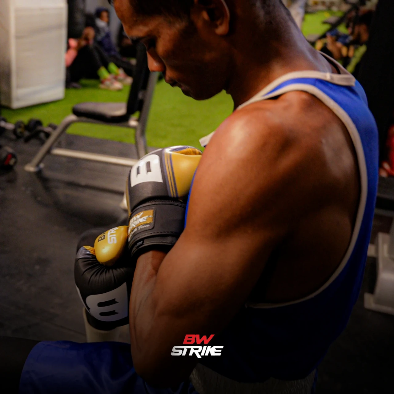 BW Strike product photography — Yellow glove in a gym portrait