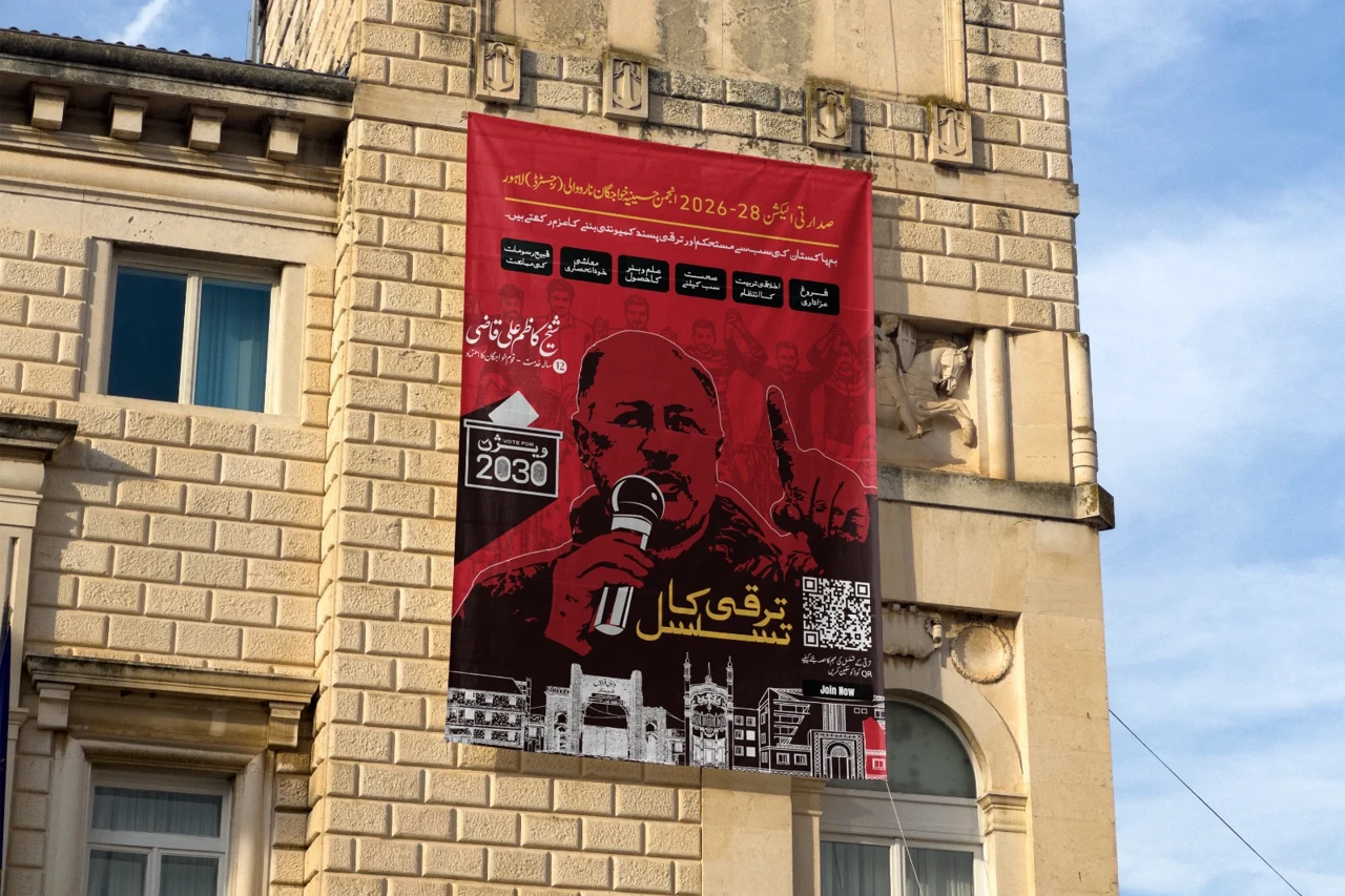 Red campaign identity on a building-scale outdoor banner