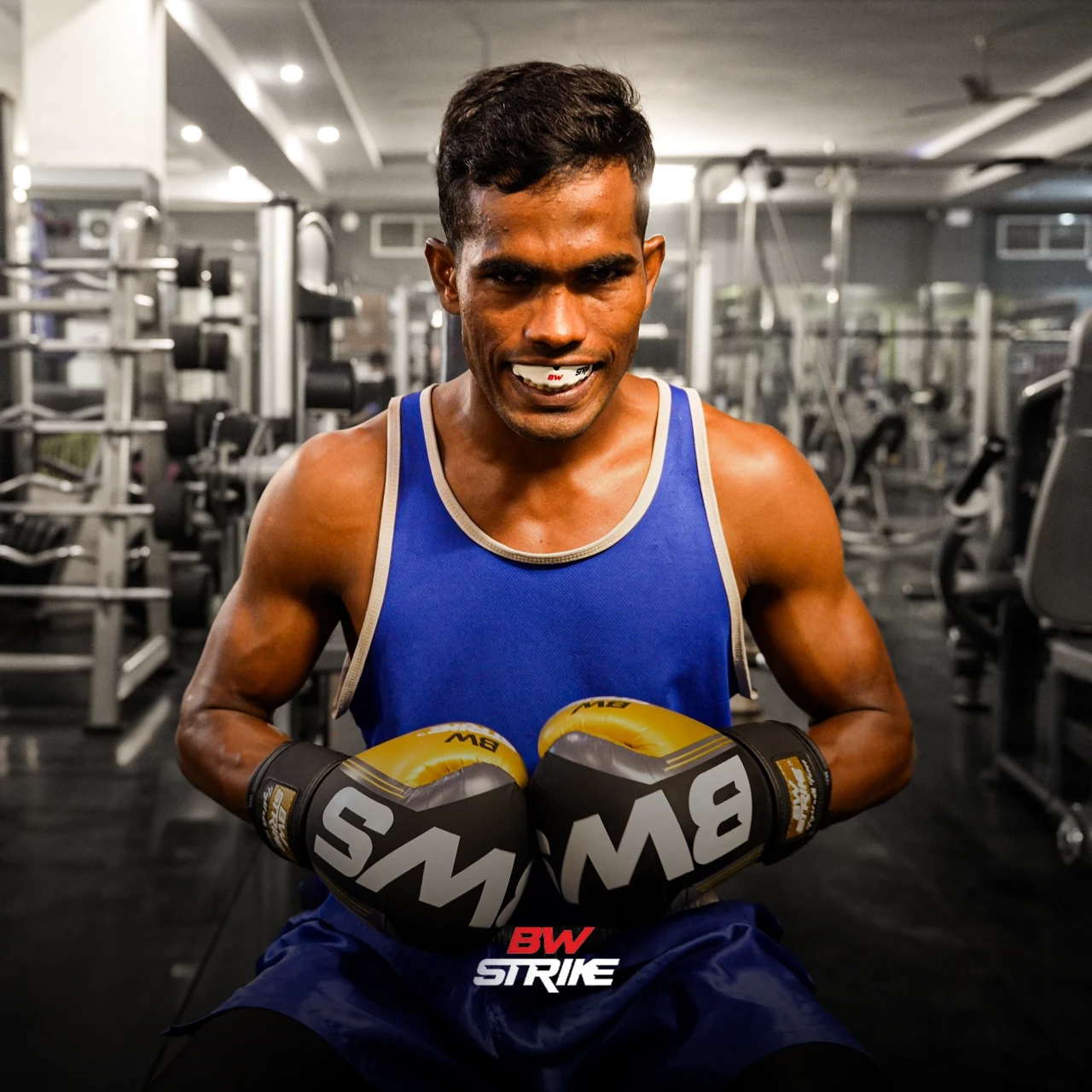 BW Strike product photography — Athlete holding boxing gloves