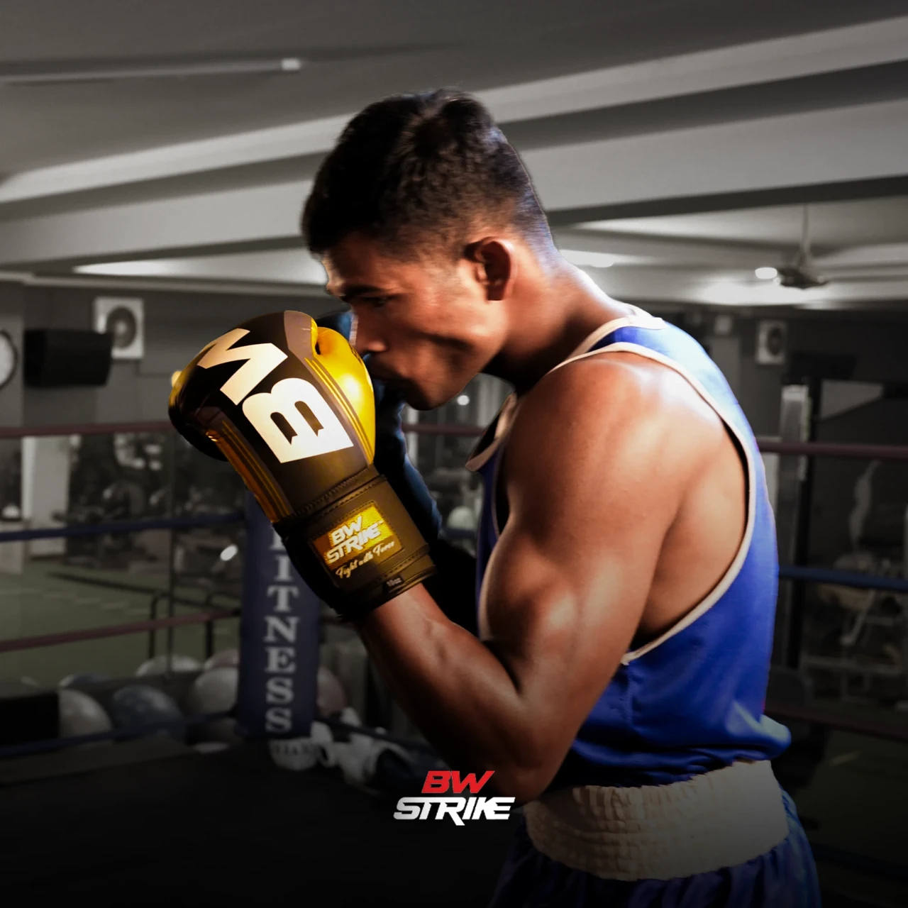 BW Strike product photography — Boxer wearing yellow gloves